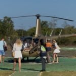 Wisatawan menikmati panorama Bali dari udara menggunakan helikopter